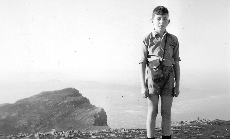 Albie standing on Maclear Beacon, highest point on Table Mountain.