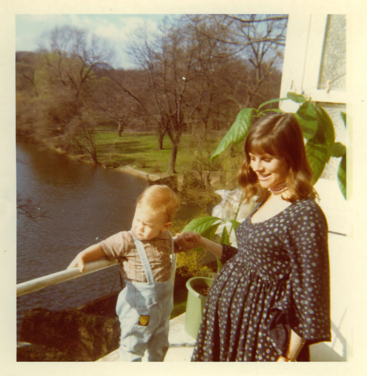 Baby Alan with mom Stephanie Kemp, pregnant, at the family home overlooking the pond at South Hill Park.