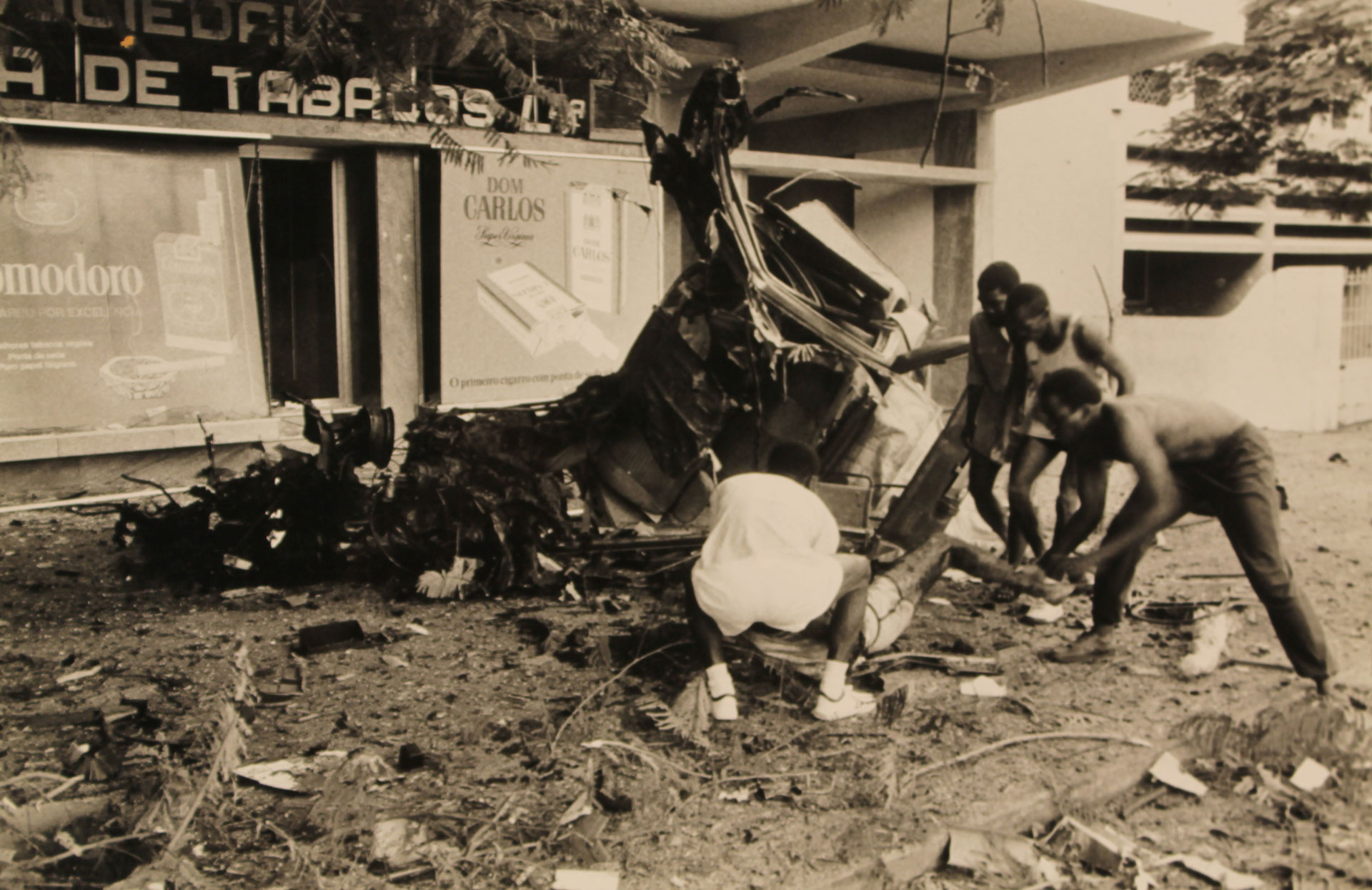 Bystanders help Albie immediately after the bomb explodes in his car.