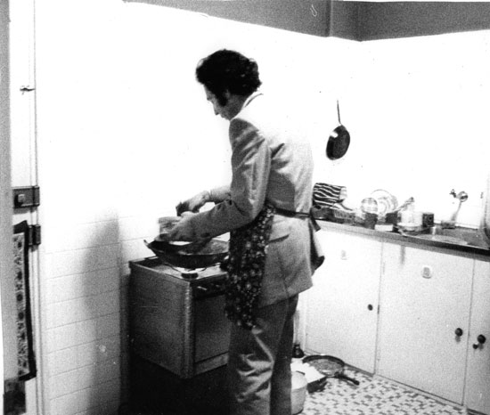 Albie cooking for visitors in his apartment in Maputo.