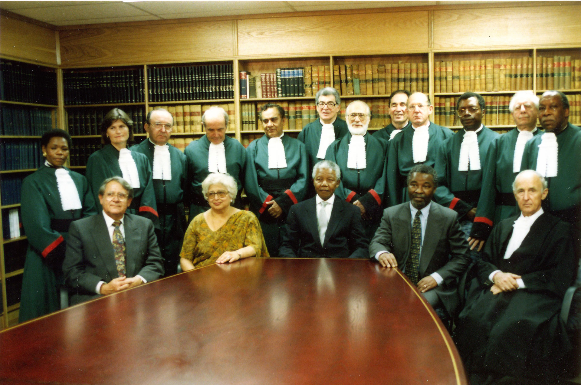 Formal picture of the original Judges of the Constitutional Court, together with Acting Judge Sir Sydney Kentridge, who acted on the Court when Richard Goldstone became First Prosecutor at the former Yugoslav War Crimes Tribunal at the Hague.