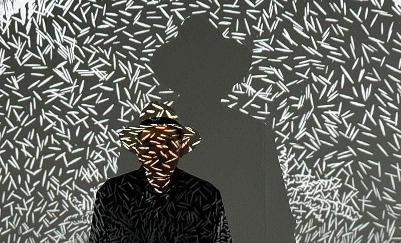 Albie with Justice under a tree artwork projection