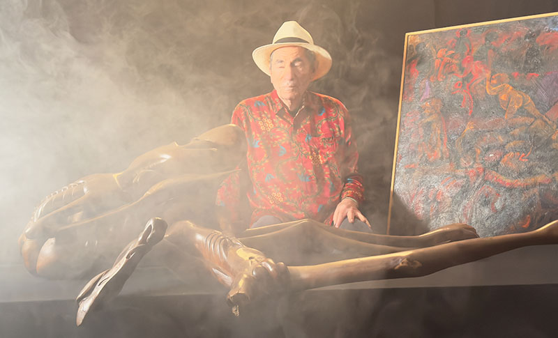 Albie with Malangatana painting and Govane sculpture in studio