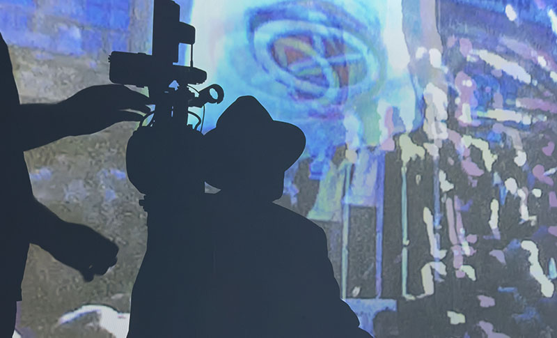 Albie watching archival projection in studio
