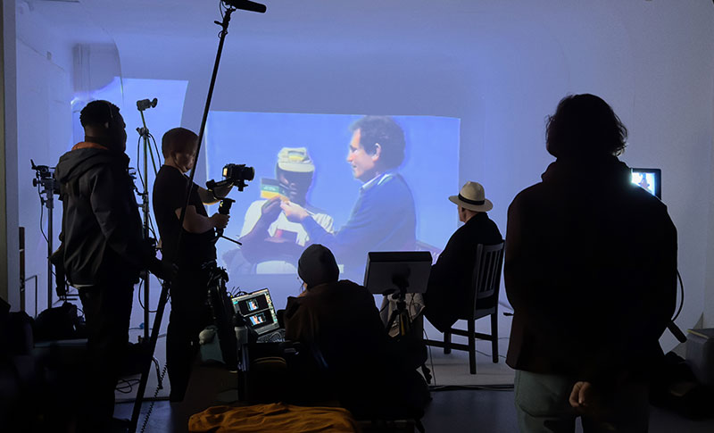 Albie watching archival projection in studio
