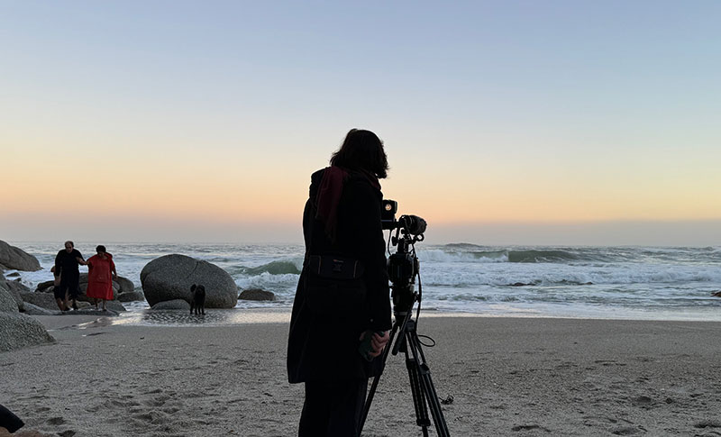Sara Gouveia films Albie and Vanessa in sea at sunrise on beach at Clifton