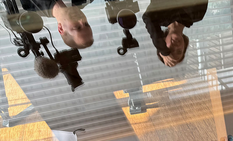 Sara Gouveia and Gray Kotze reflection in table at Clifton